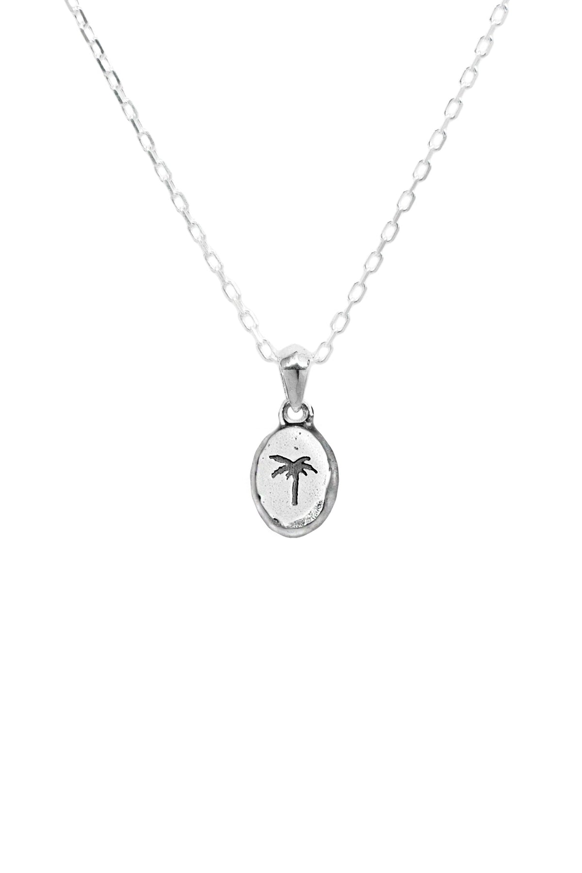 A silver chain necklace with an oval pendant featuring a small palm tree engraving, shown against a plain white background.