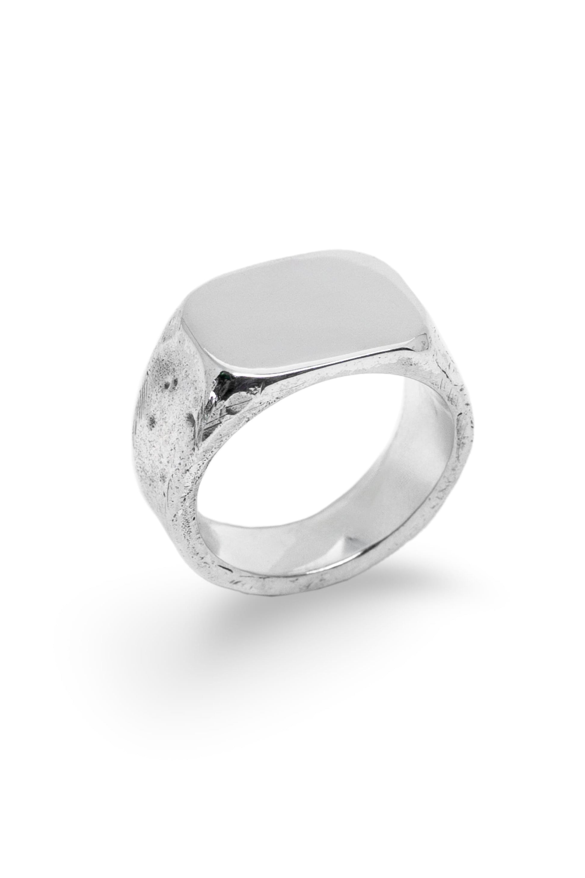 Recycled silver signet ring with a large rectangular flat face and lightly textured band on a white background.